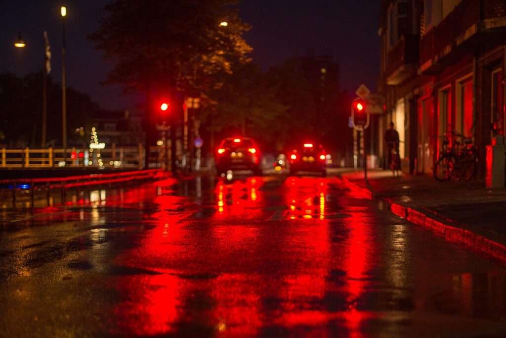 HILO tyres on a wet city street at night