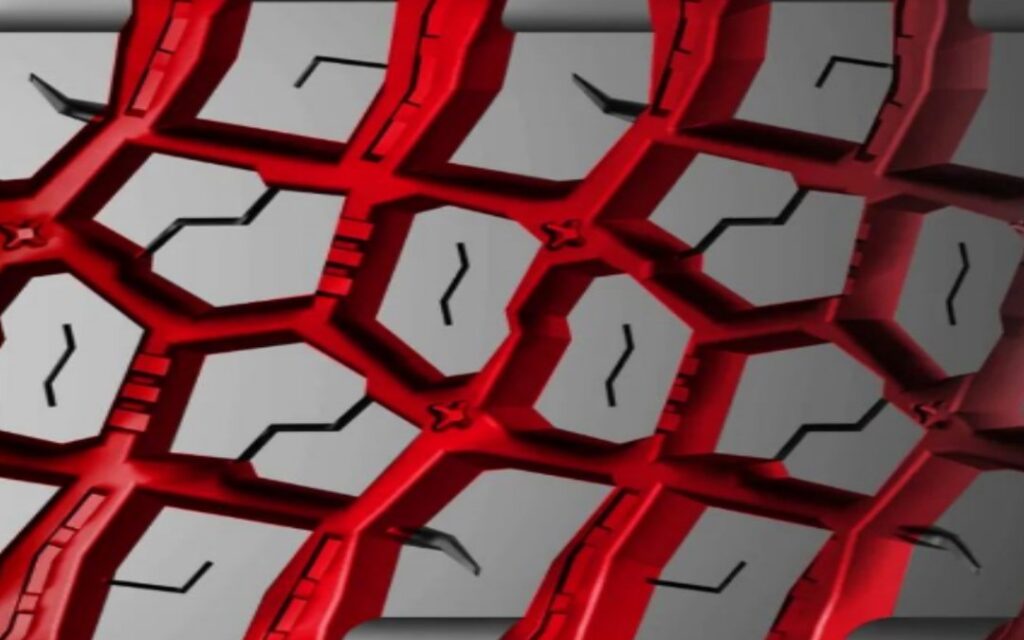 Close-up of the HILO X-TERRAIN MT1 open shoulder tread, with the mud-clearing grooves highlighted